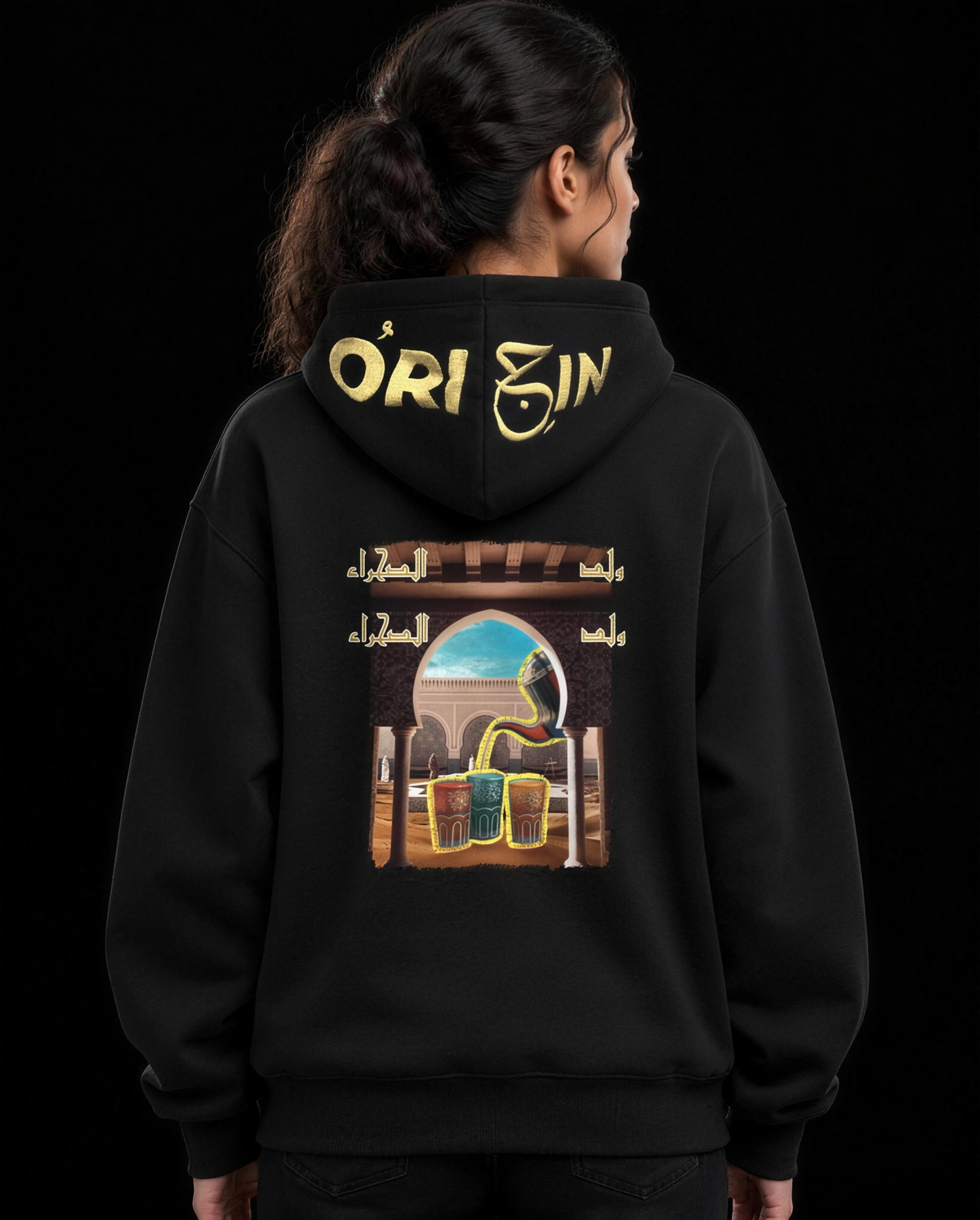 Weld El Sahraa Hoodie Black / Gold – back, Weld El Sahraa tea-pouring archway print with cream Origin logo on the hood